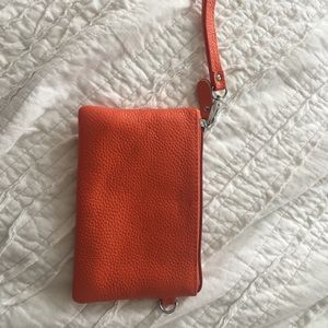 Orange leather clutch purse or wallet